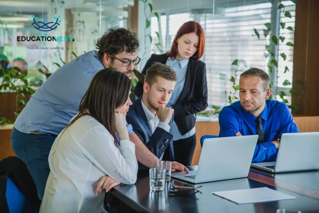 Business professionals collaborating in an office setting, highlighting the importance of certification programs for employee growth.