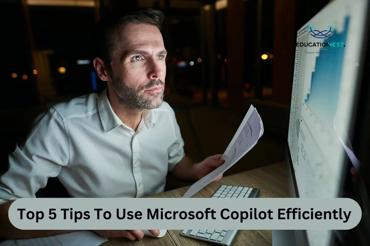 A man gazes intently at a computer screen, illuminated in the dark of night, focusing on Microsoft Copilot tips.