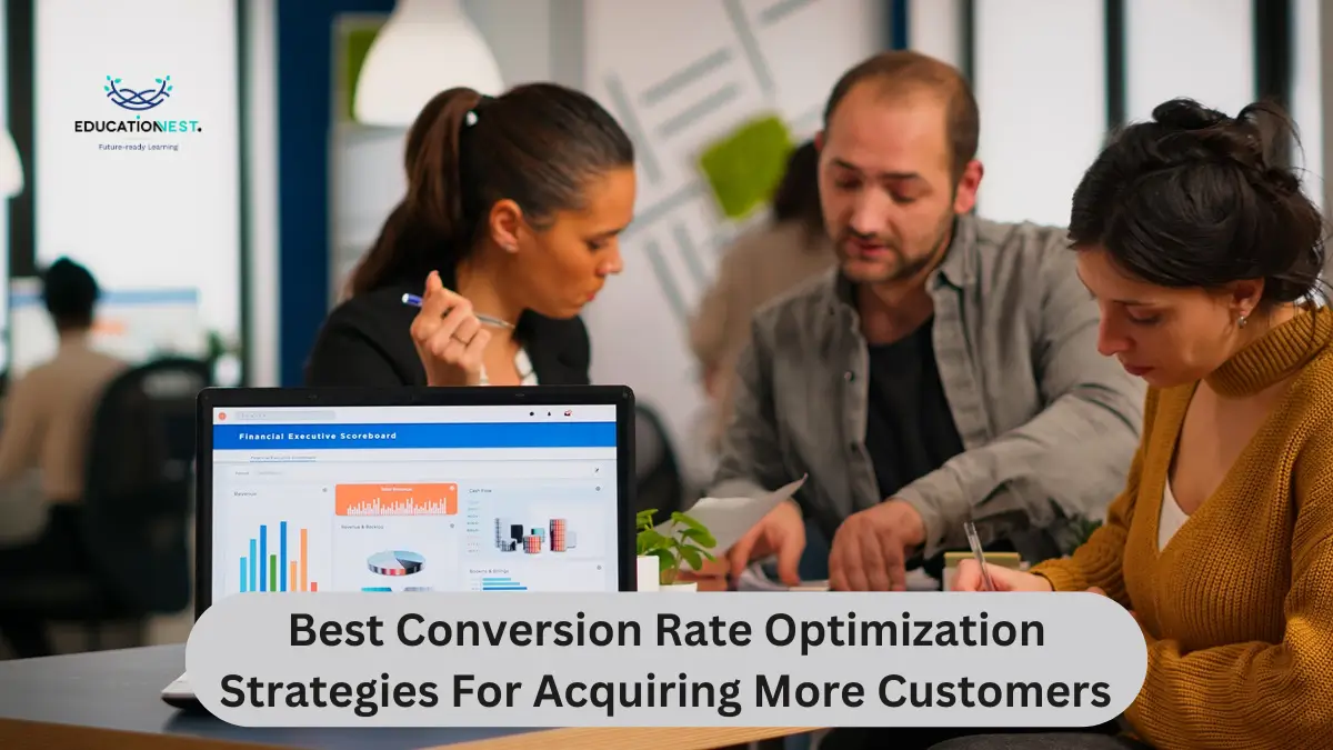 Three individuals collaborate at a table, focused on a laptop, discussing conversion rate optimization strategies.