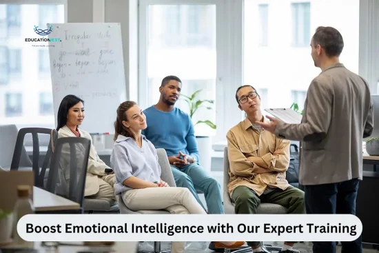 A group of professionals seated in an office, engaged in a training session on boosting emotional intelligence.