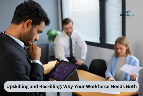 A man in a suit examines a tablet, reflecting on the importance of upskilling and reskilling in the workforce.