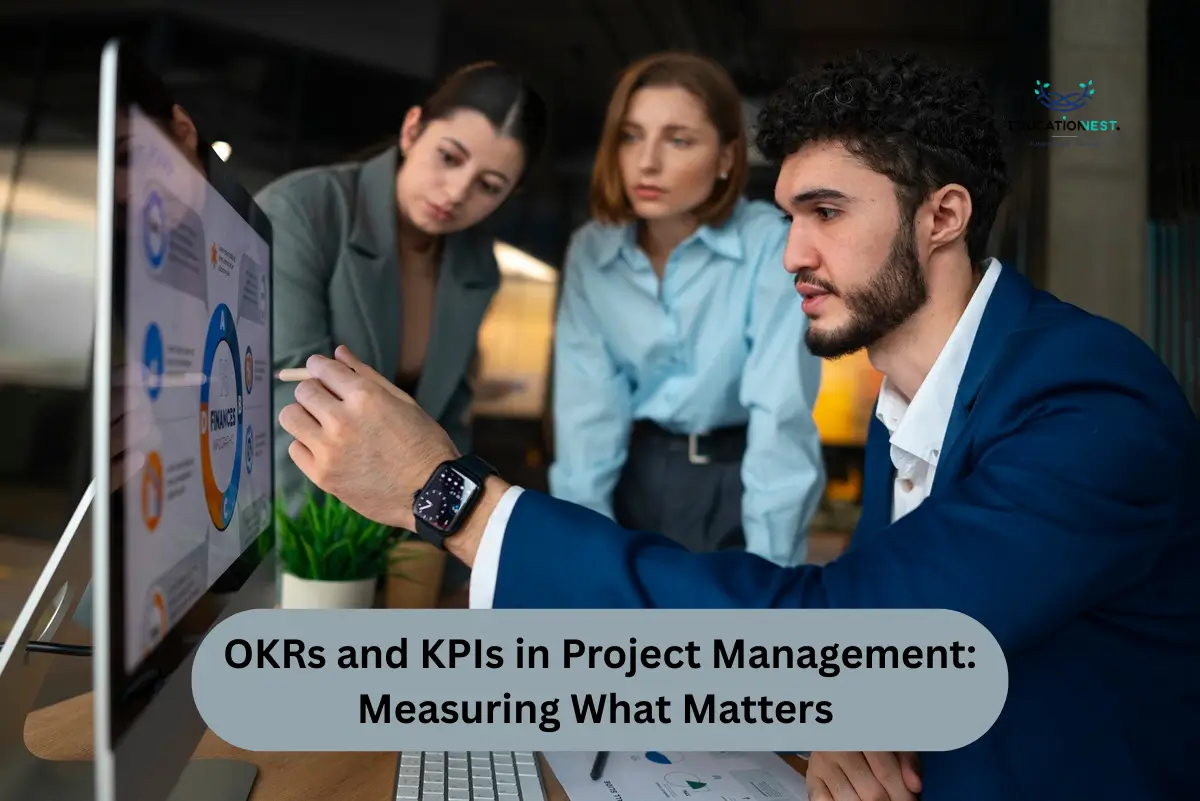 Three business professionals analyzing a computer screen displaying OKRs and KPIs in project management.