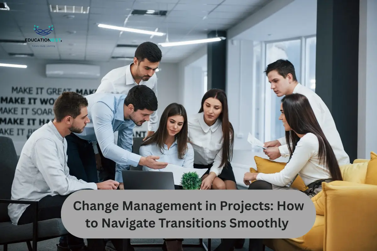 Young professionals in a modern office discussing documents and planning around a laptop, illustrating teamwork in Change Management in Projects.